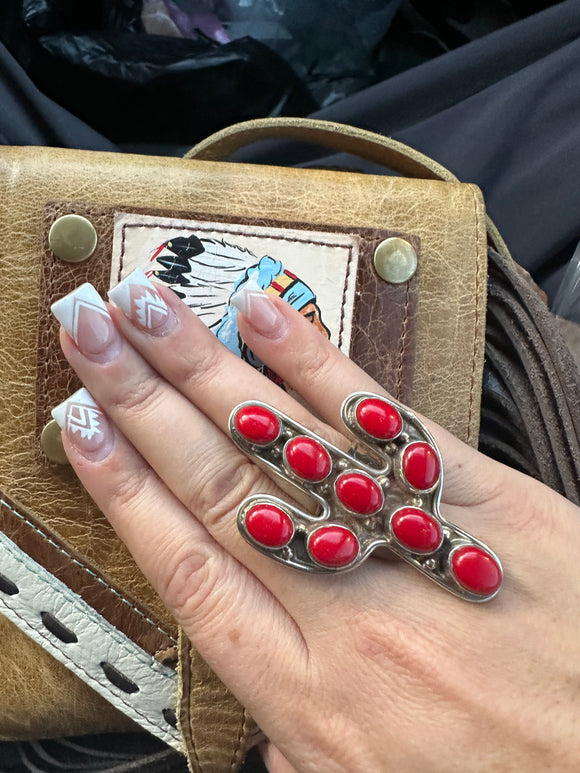 Ring with large red colored cactus pendant